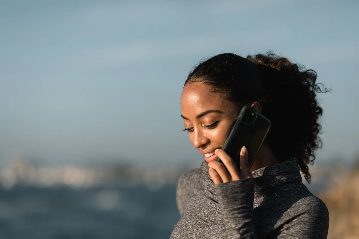 An adult speaking on the phone